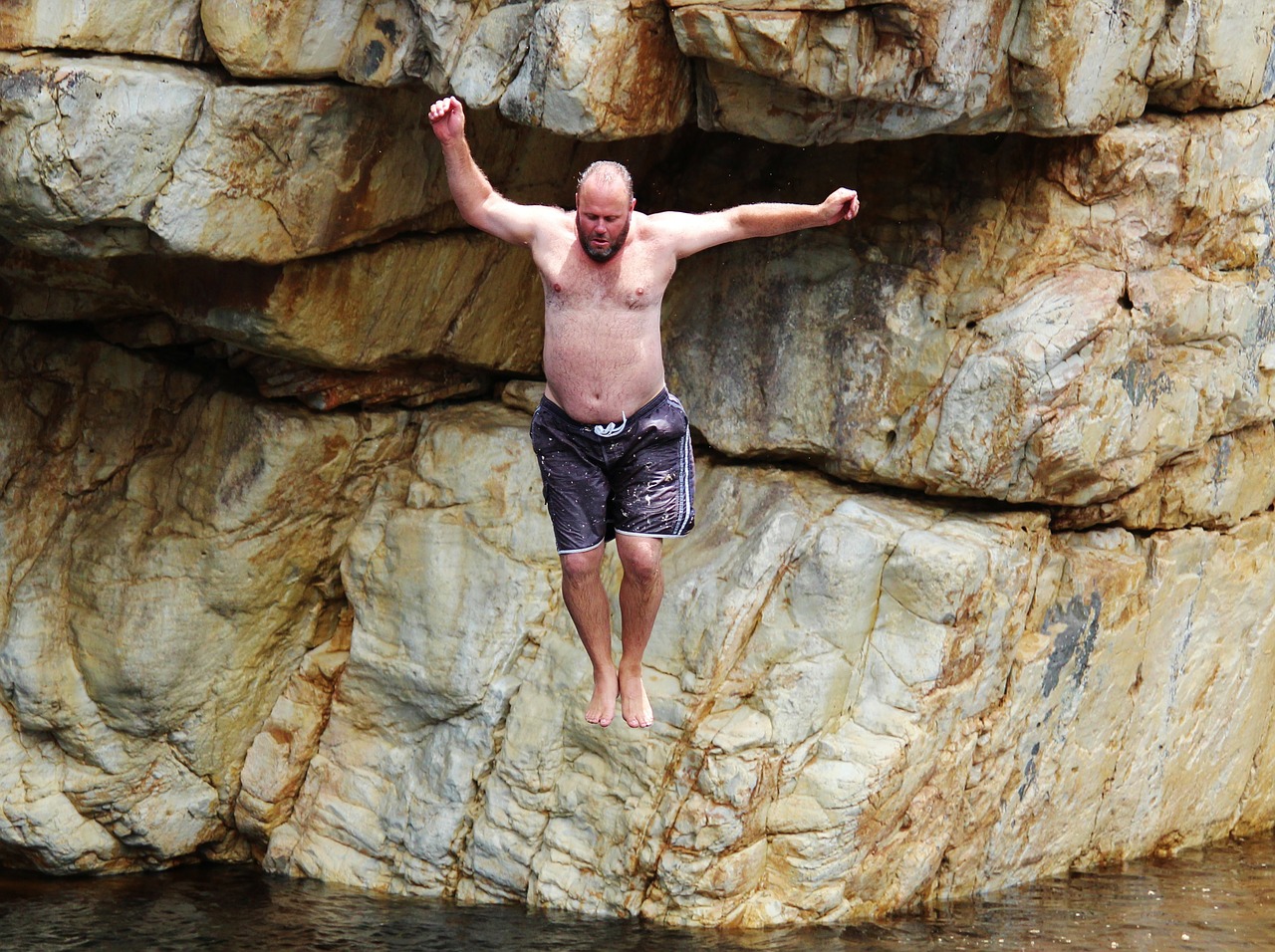 rock jump courageous free photo