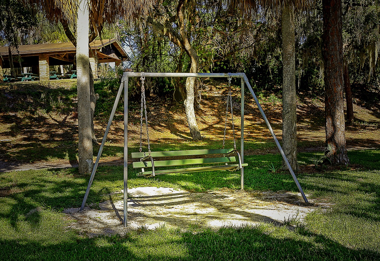 rocking bench recreational park green area free photo