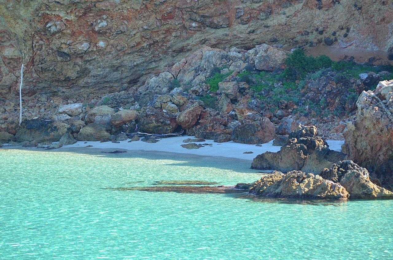 rocks beach sand free photo