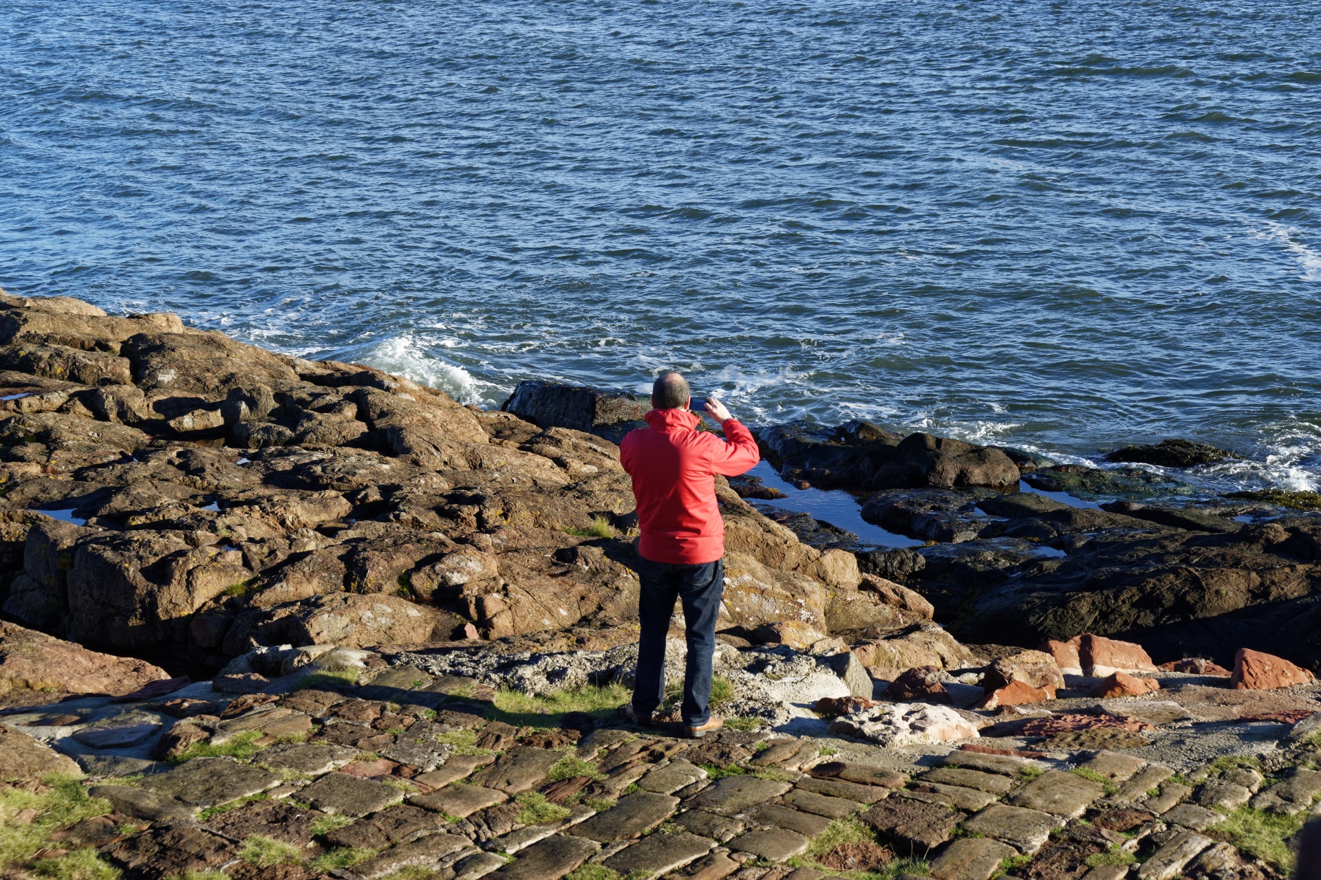 seaside man mobile phone free photo