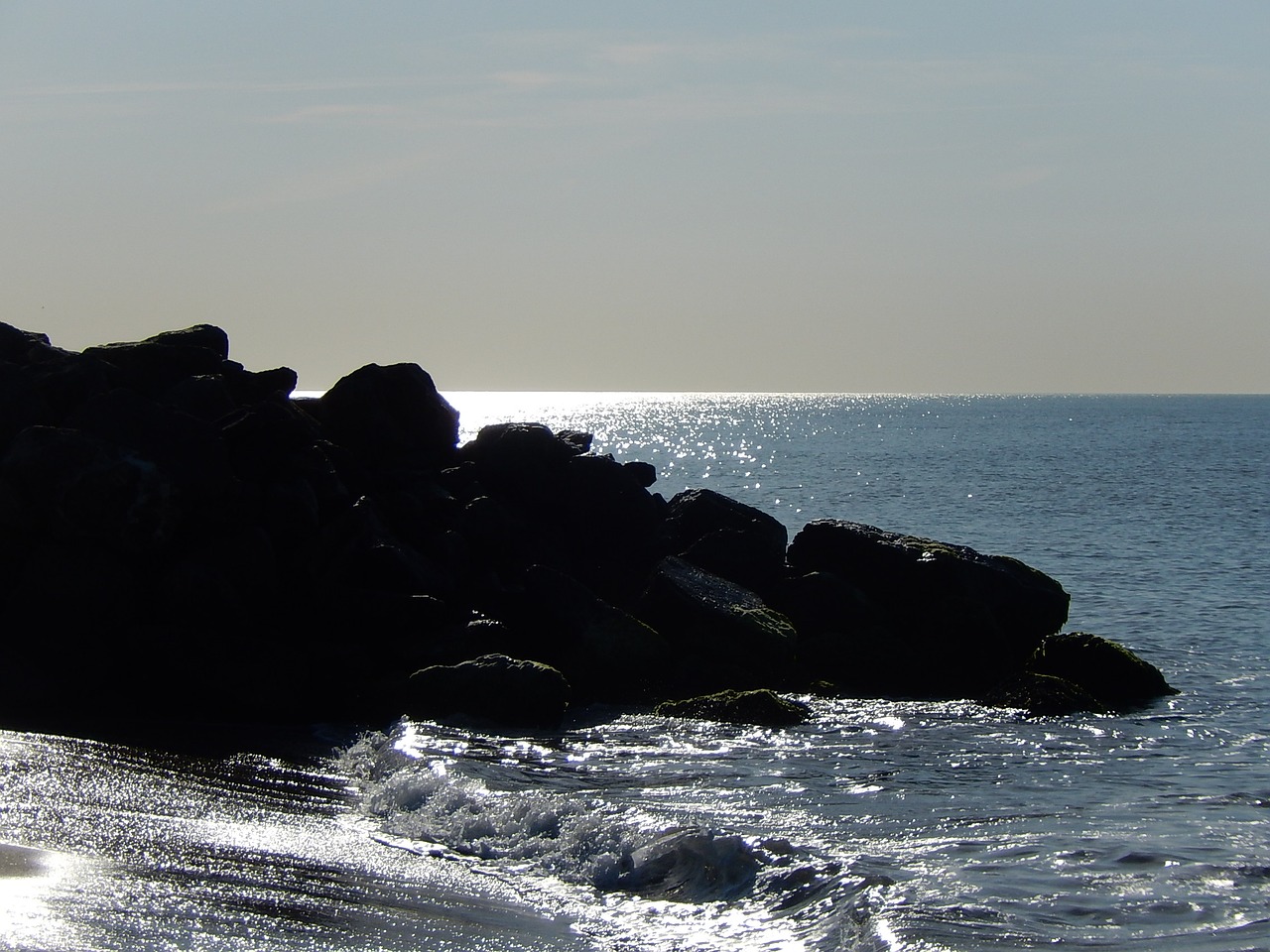 rocks in the edge of the sea calm free photo