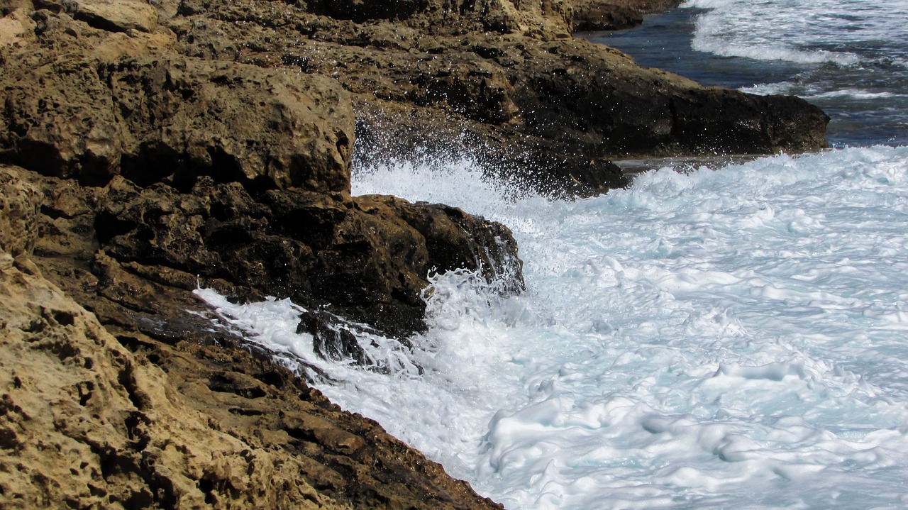 rocky coast wave smashing free photo