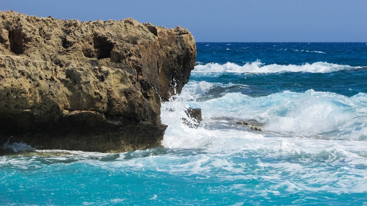 rocky coast wave smashing free photo