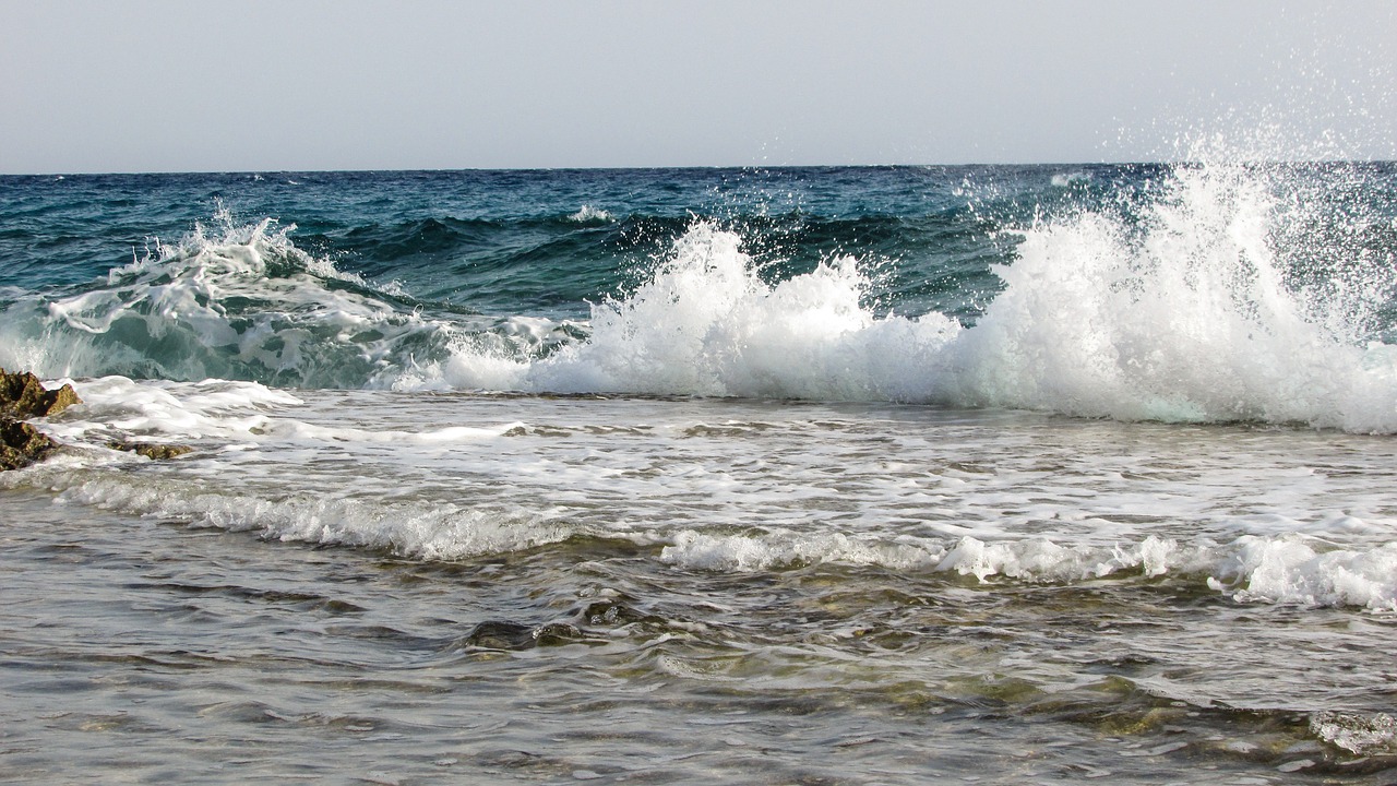 rocky coast wave smashing free photo