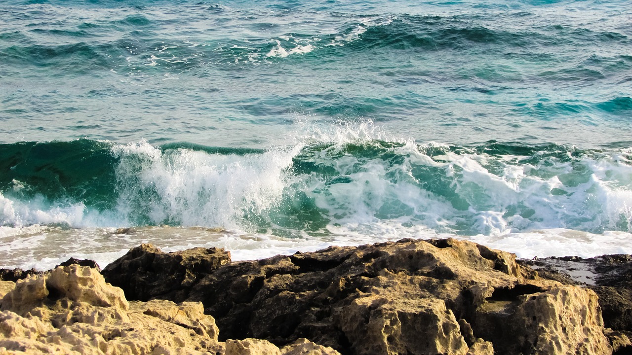 rocky coast wave smashing free photo