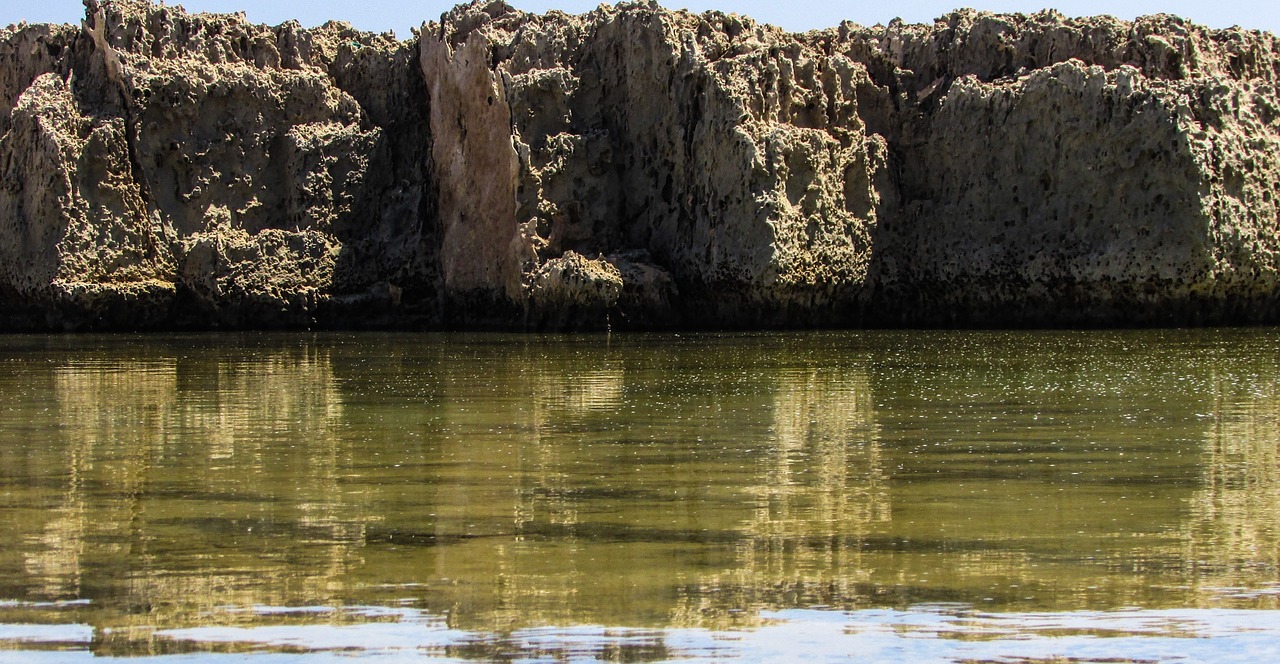 rocky coast formations water free photo