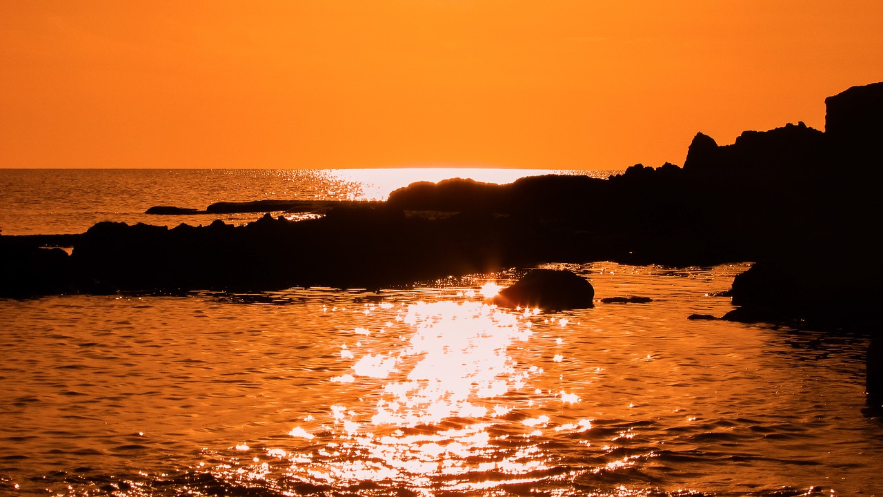 rocky coast sunset sea free photo