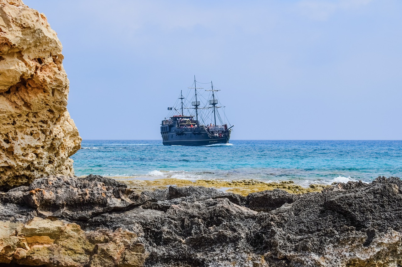 rocky coast landscape pirate ship free photo