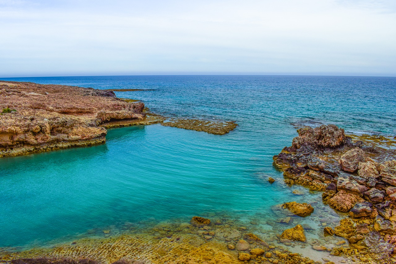 rocky coast lagoon turquoise free photo