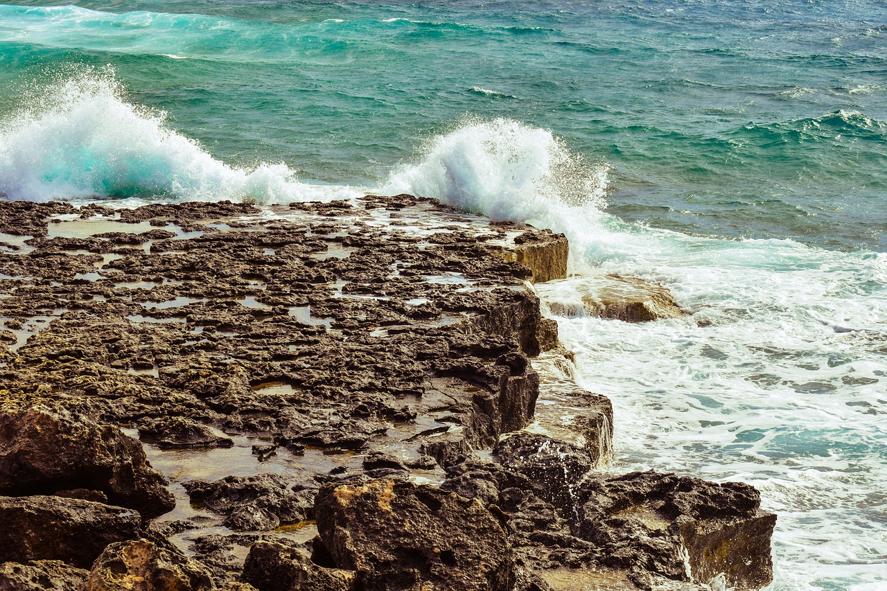 rocky coast wave smashing free photo