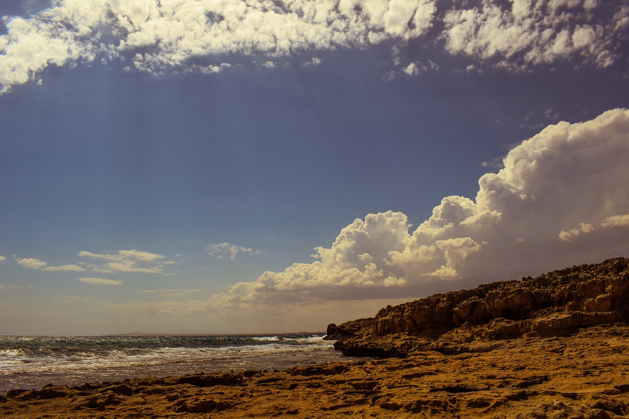 rocky coast sky clouds free photo