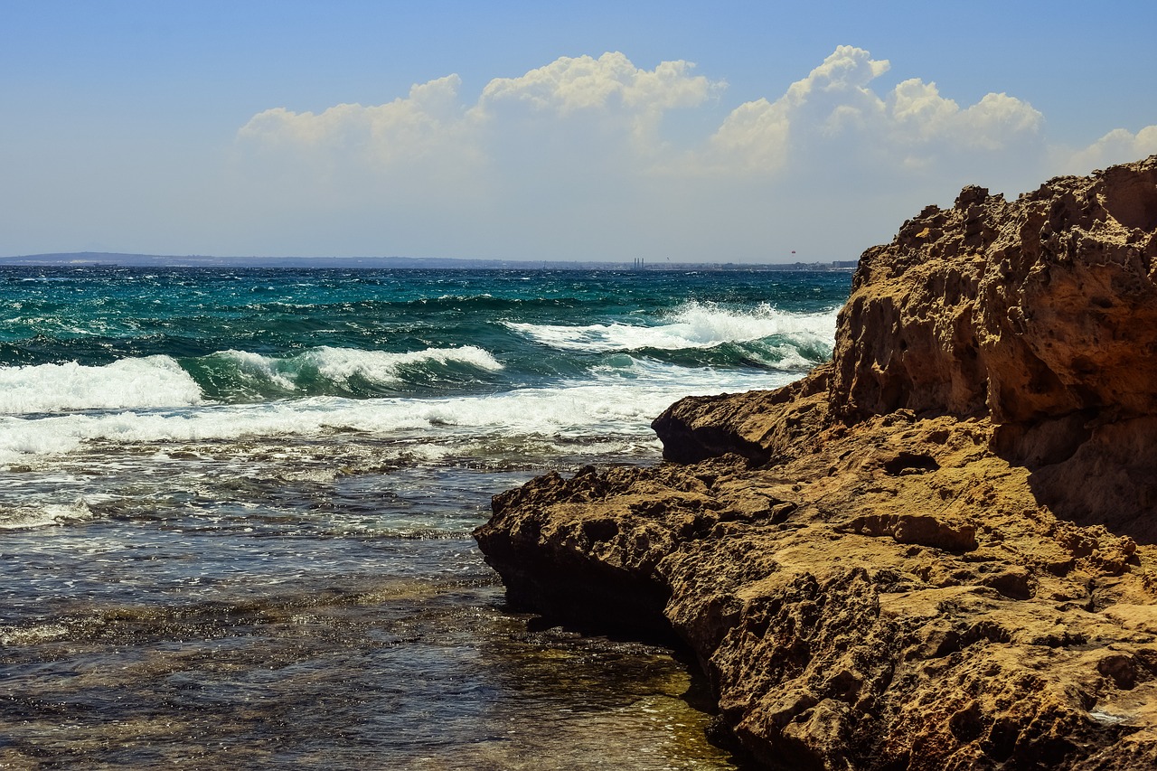 rocky coast waves sky free photo