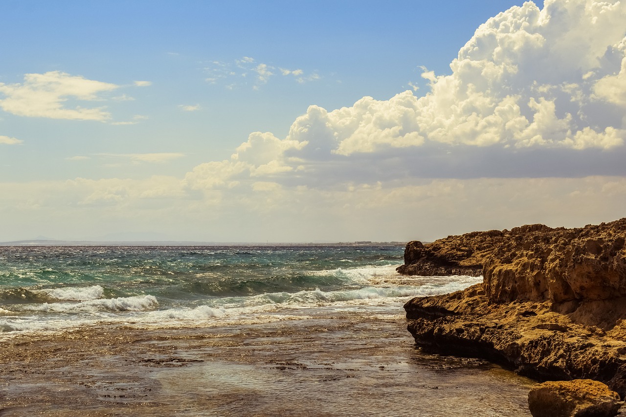 rocky coast sky clouds free photo