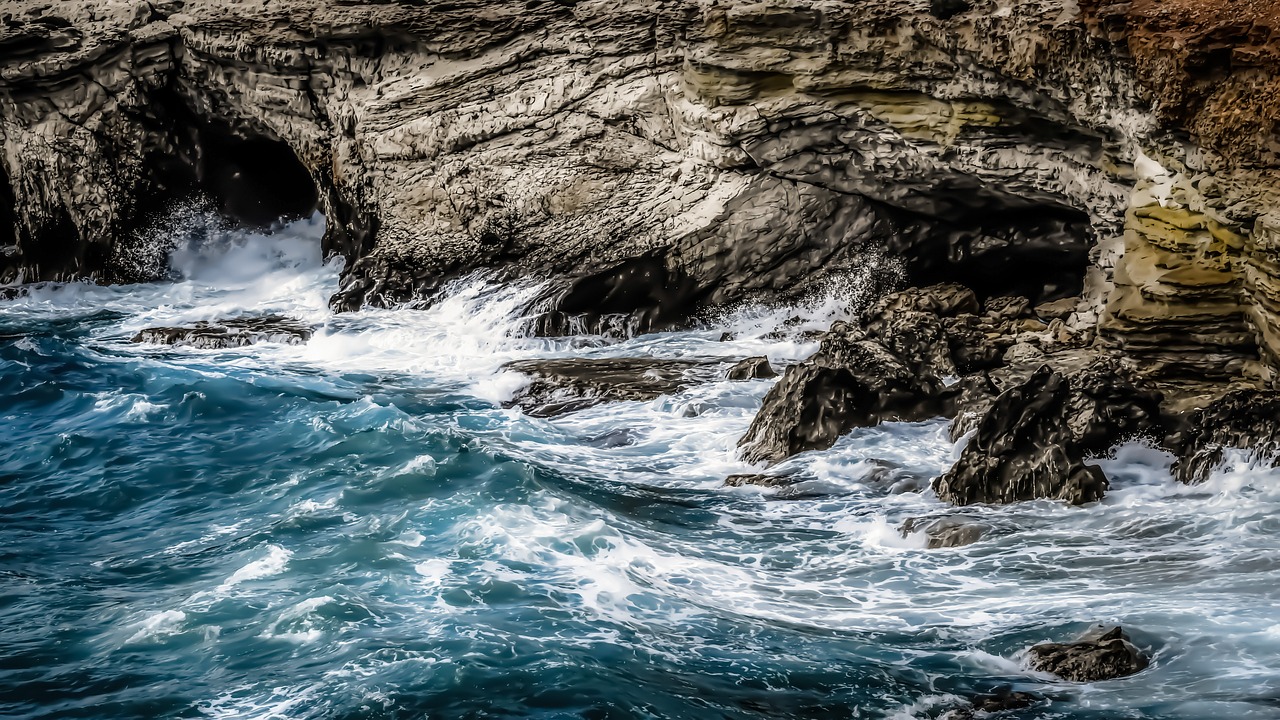 rocky coast sea caves waves free photo