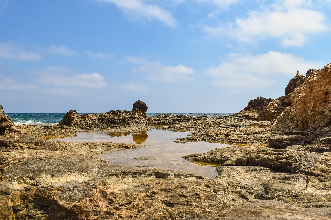 rocky coast water reflection free photo