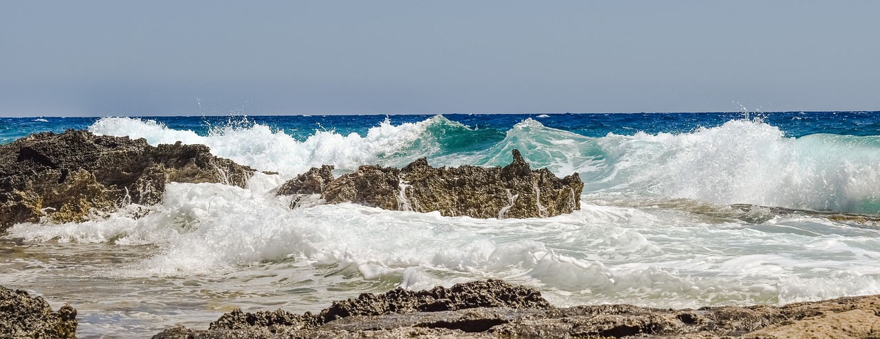 rocky coast wave smashing free photo