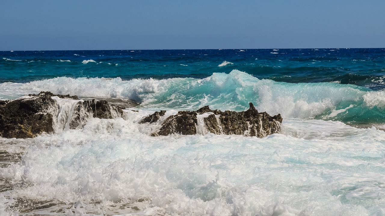 rocky coast wave smashing free photo