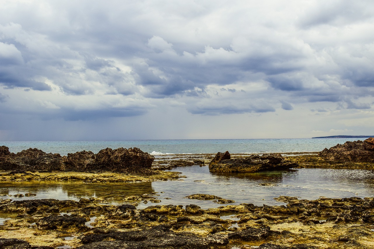 rocky coast sky clouds free photo