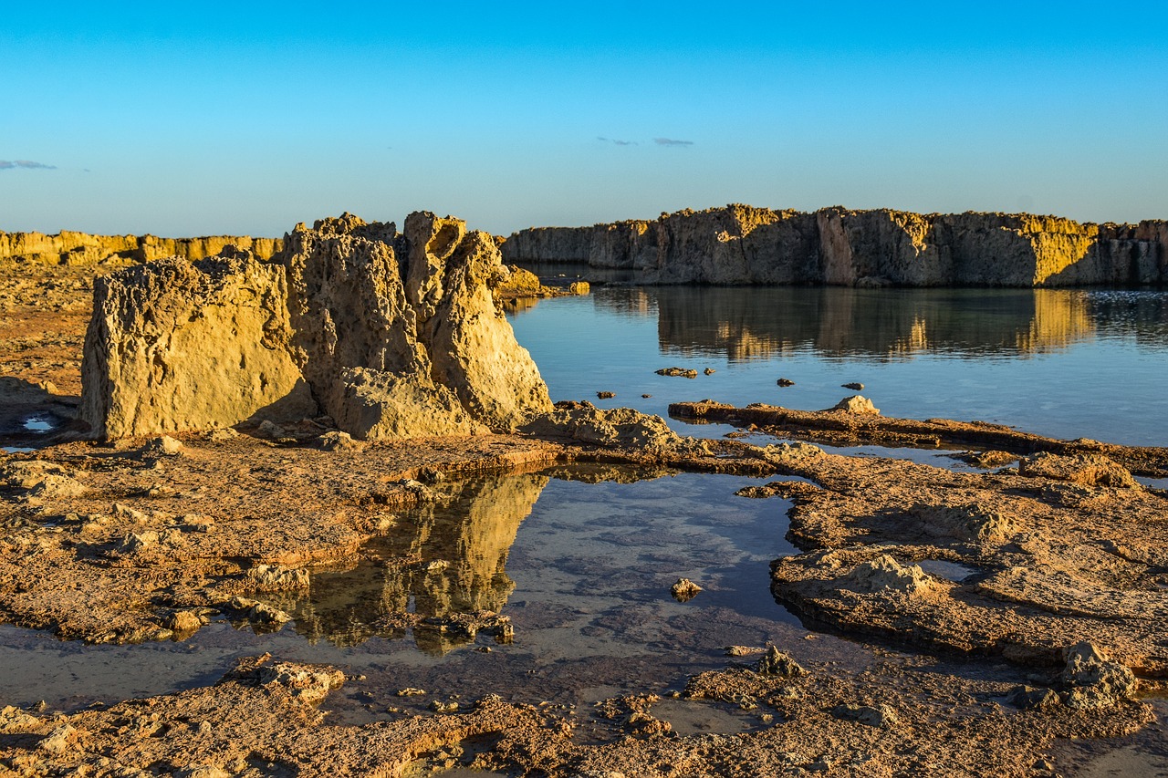 rocky coast  water  mirroring free photo