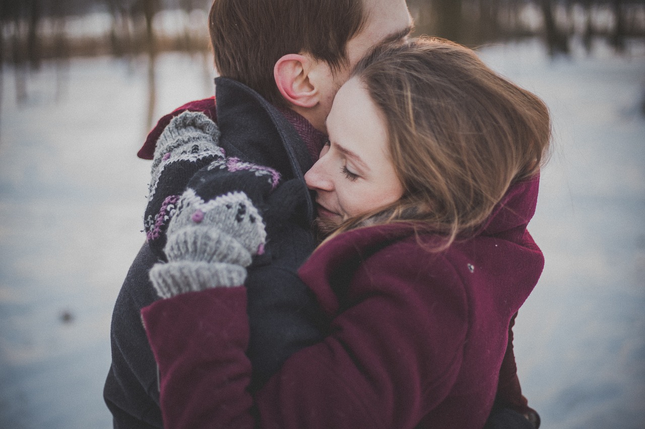 romance couple hugging wool coat free photo