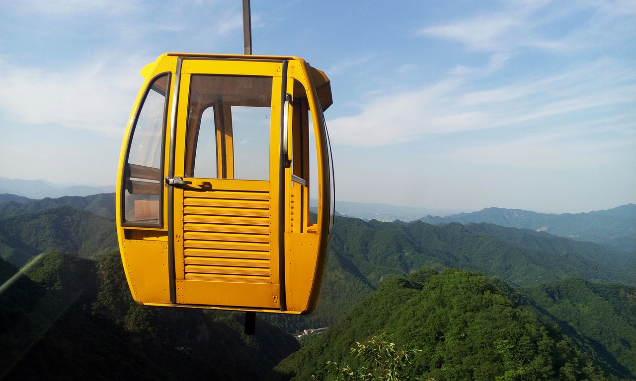 ropeway yellow distant hills free photo