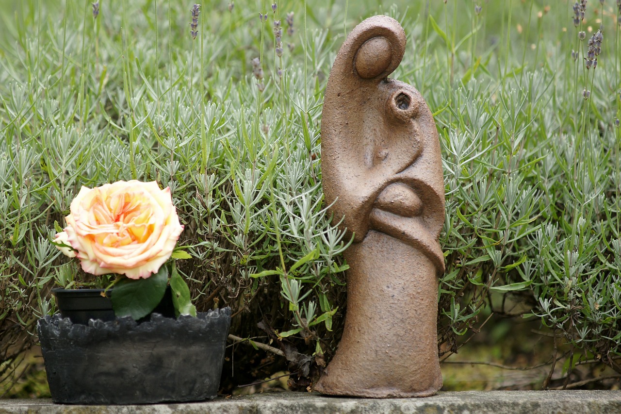 rose sculpture woman with child free photo