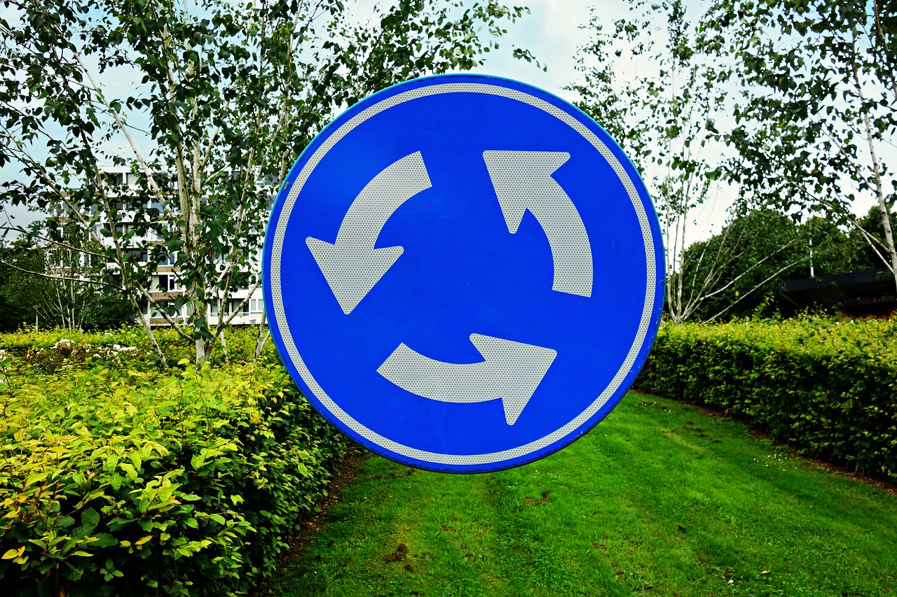 roundabout traffic sign arrow free photo