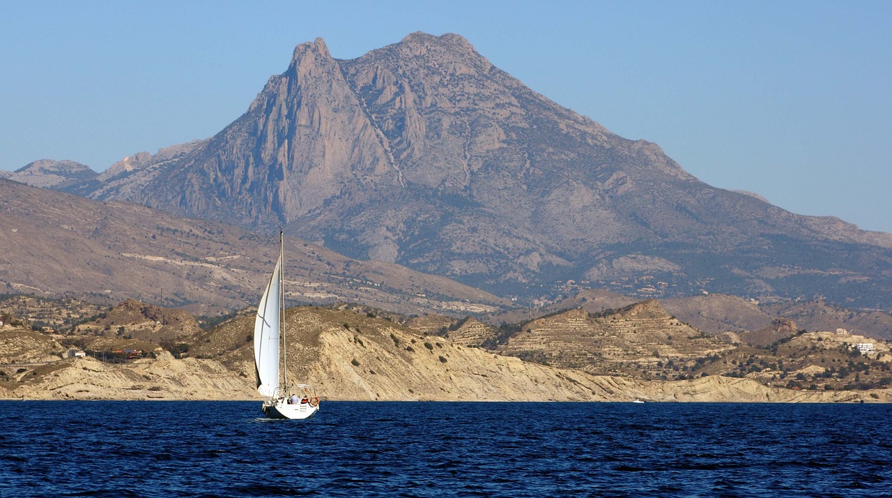 sailboat mountain water free photo