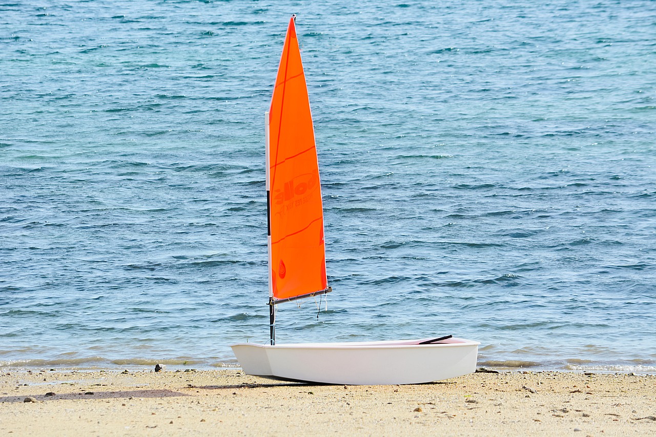 sailboat red sail beach free photo