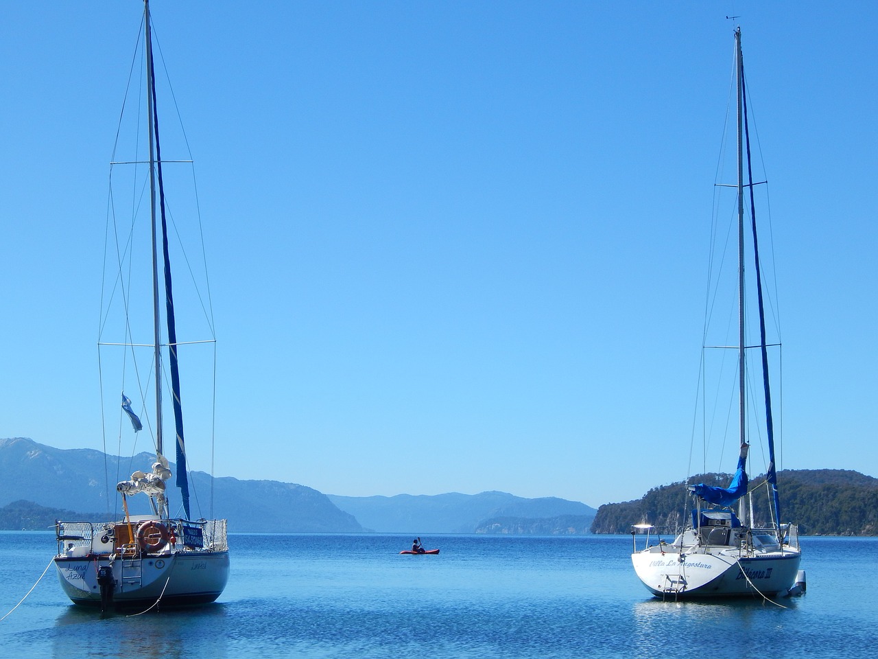 sailboat water mountain free photo