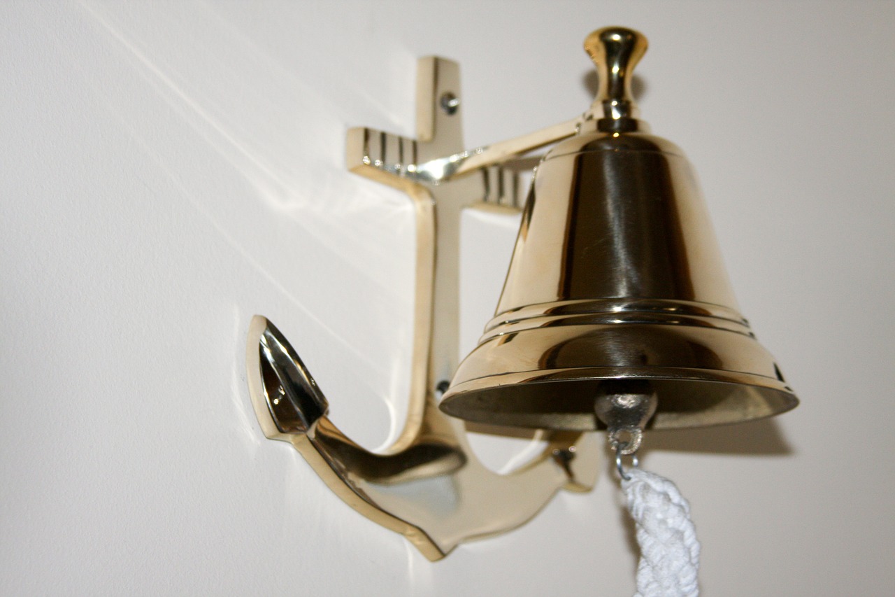 sailing brass bell bell with an anchor bell board free photo