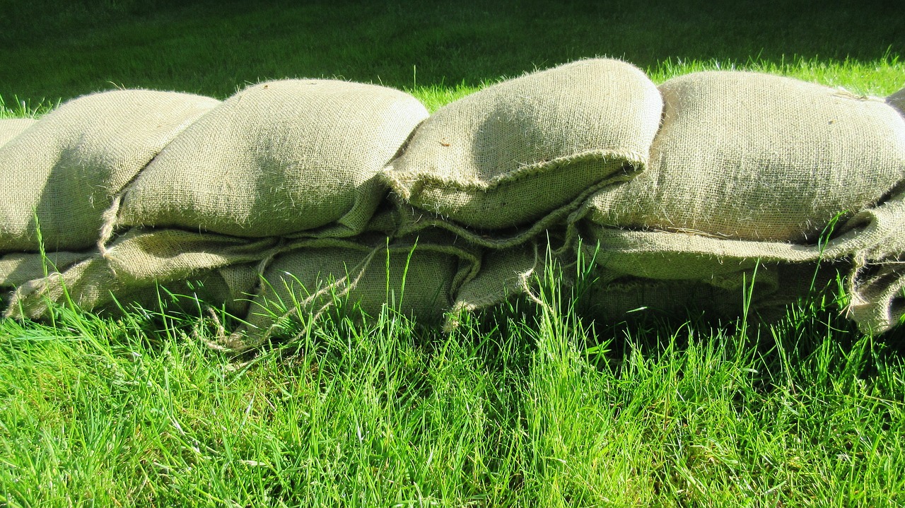 sand bags grass nature free photo