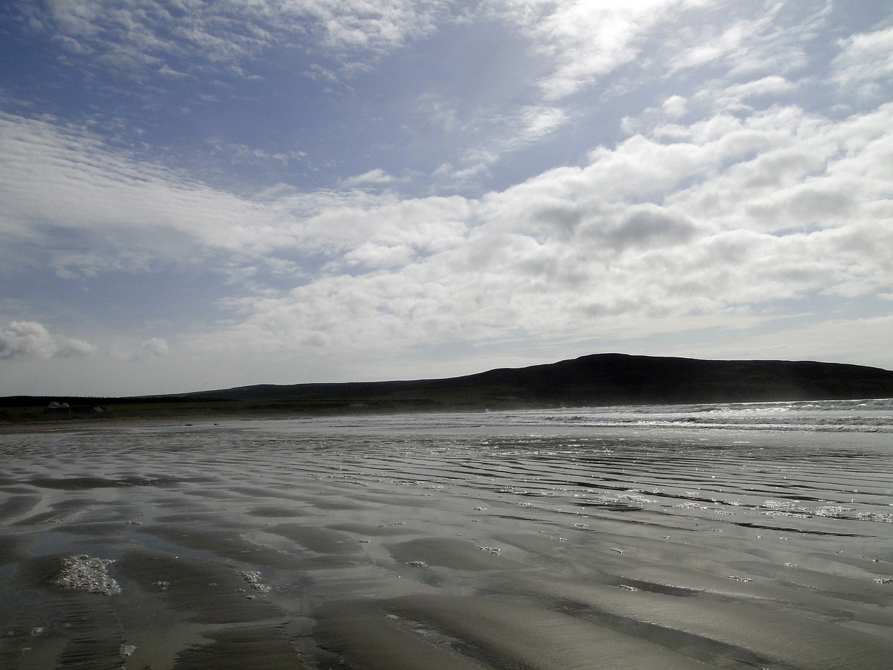 sand beach sand clouded sky free photo