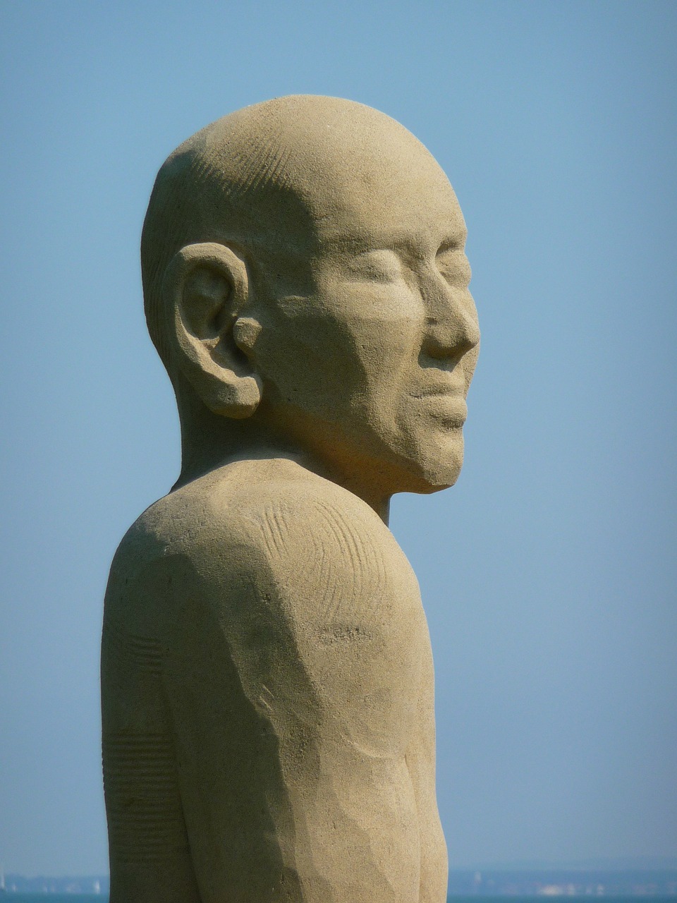 sand sculpture man face free photo