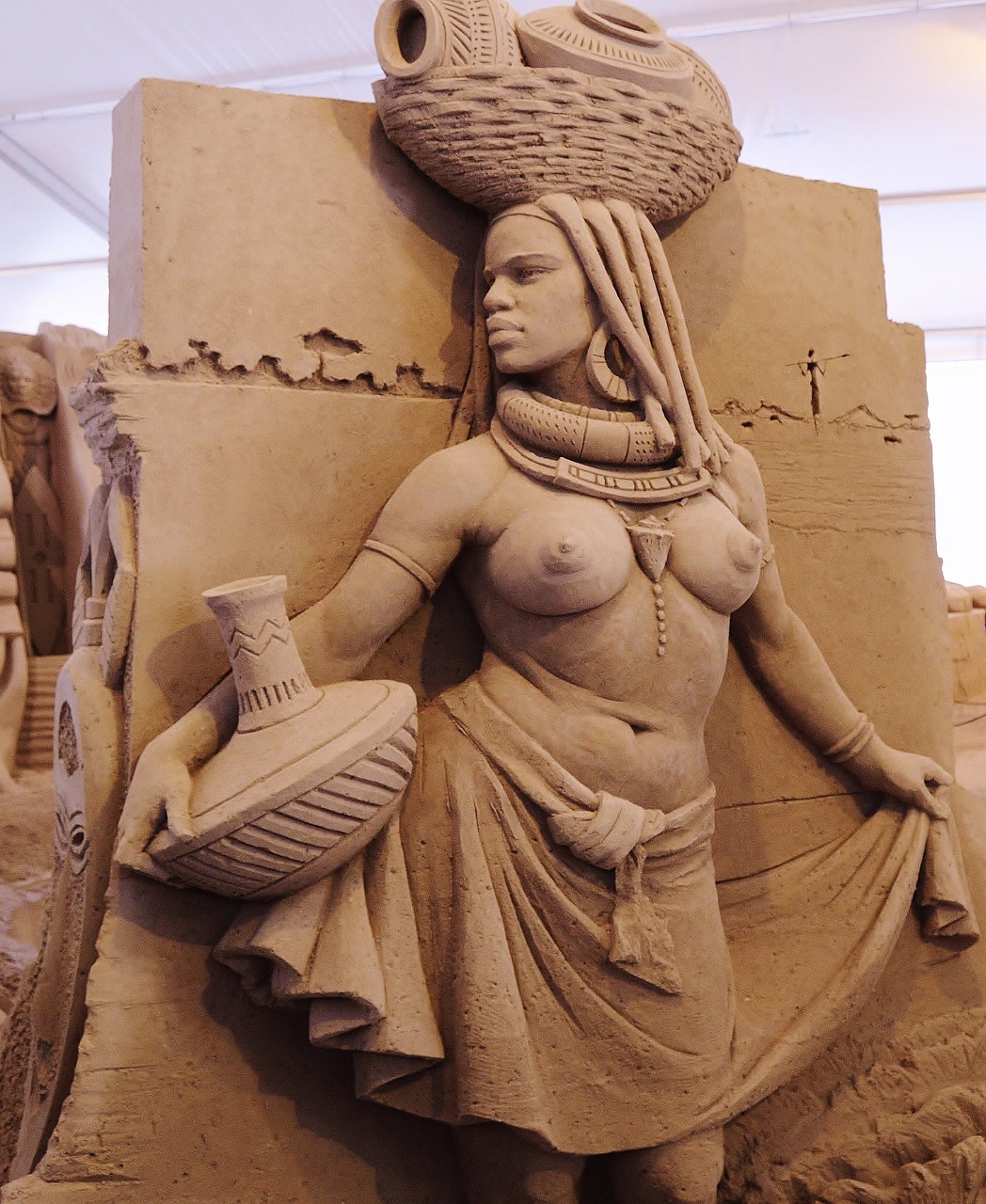 sand sculpture artwork mursi woman free photo