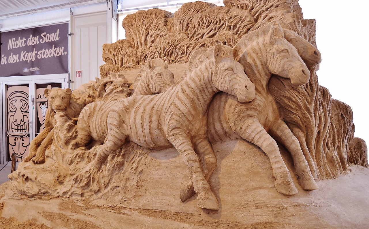 sand sculpture zebras artwork free photo