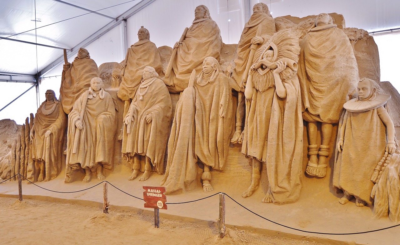 sand sculptures group massai free photo