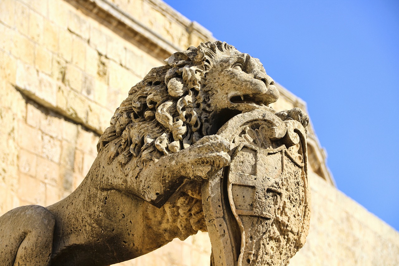 sand stone  coat of arms  lion free photo