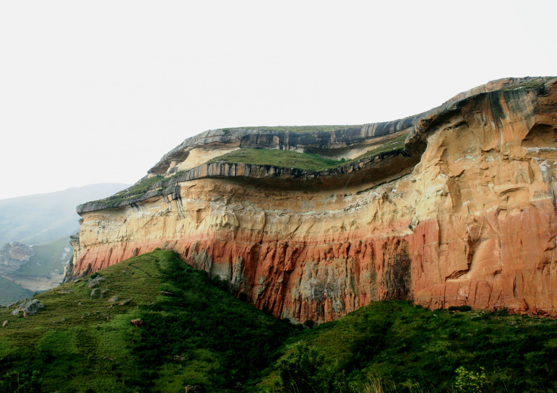 sandstone cliff yellow-orange layers free photo