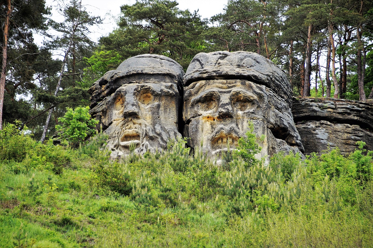sandstone rocks carved head devil's head free photo