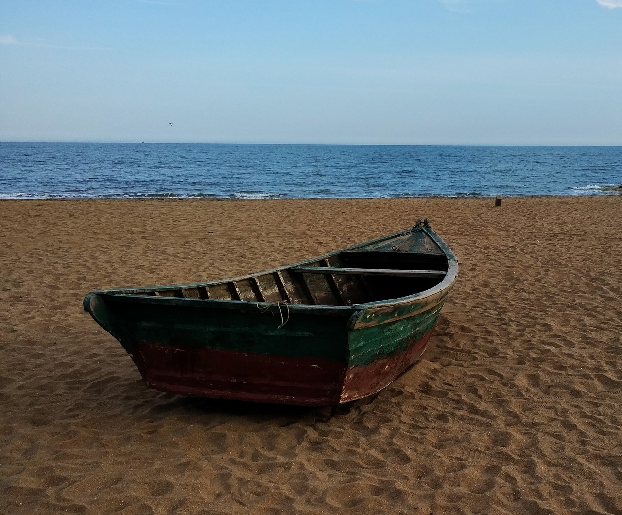 sandy beach boat free photo