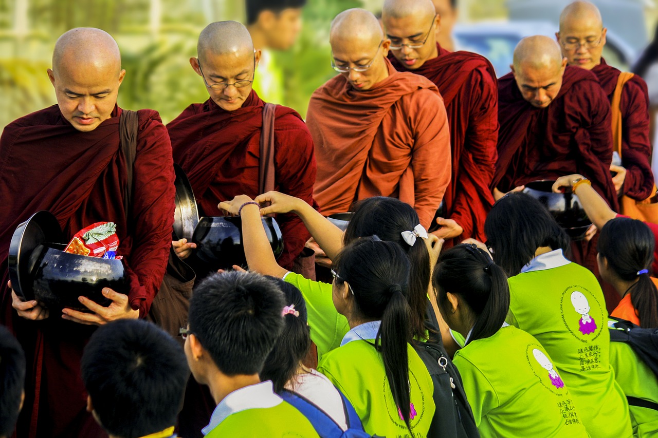 sangha theravada monks in alms-round offering to the sangha free photo