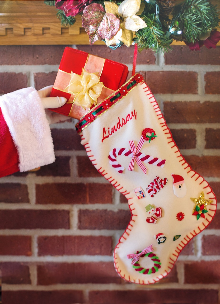 santa's arm christmas stocking gift free photo