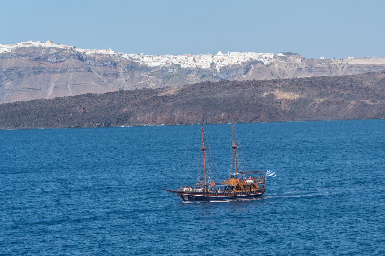 santorini pirate ship mountains free photo