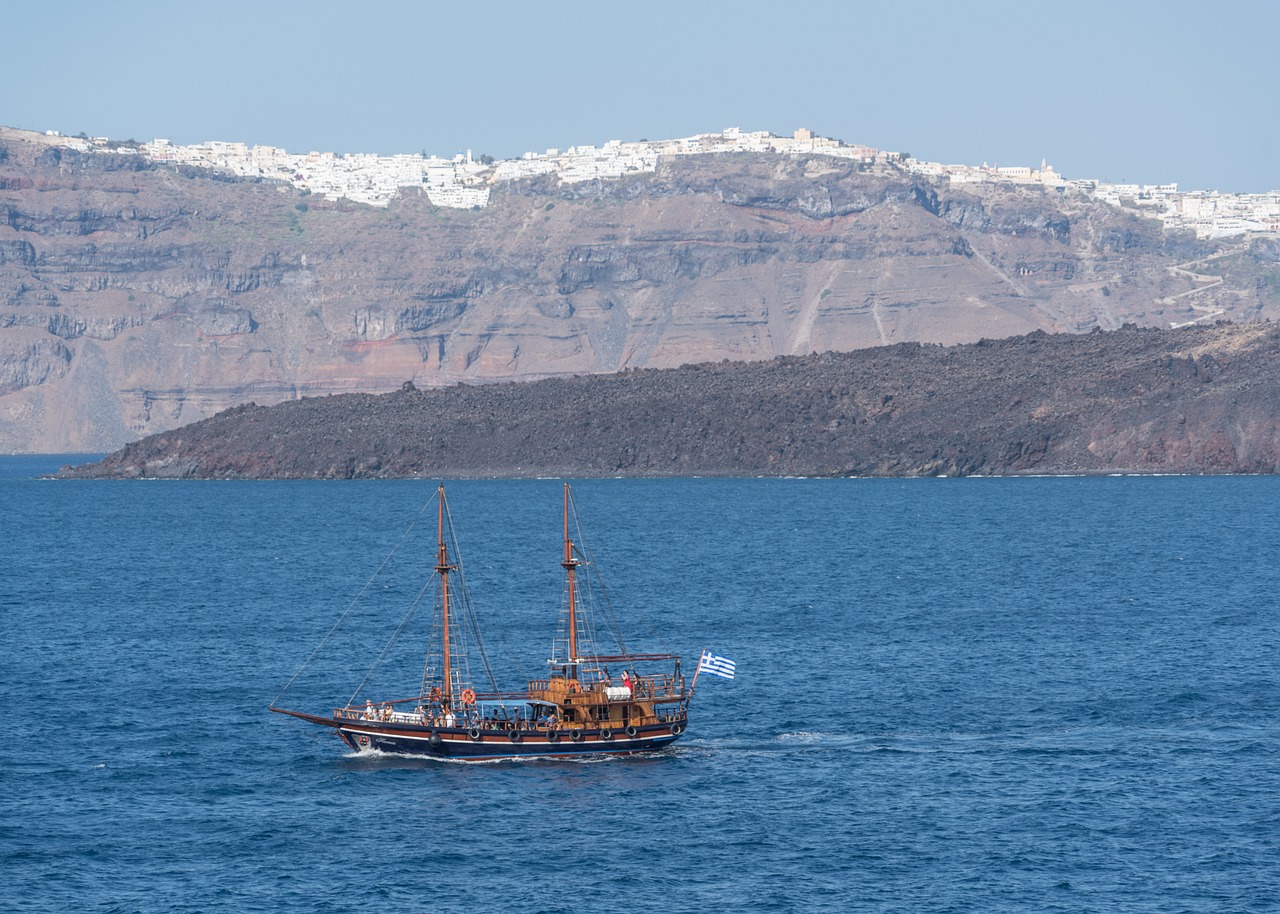 santorini pirate ship mountains free photo