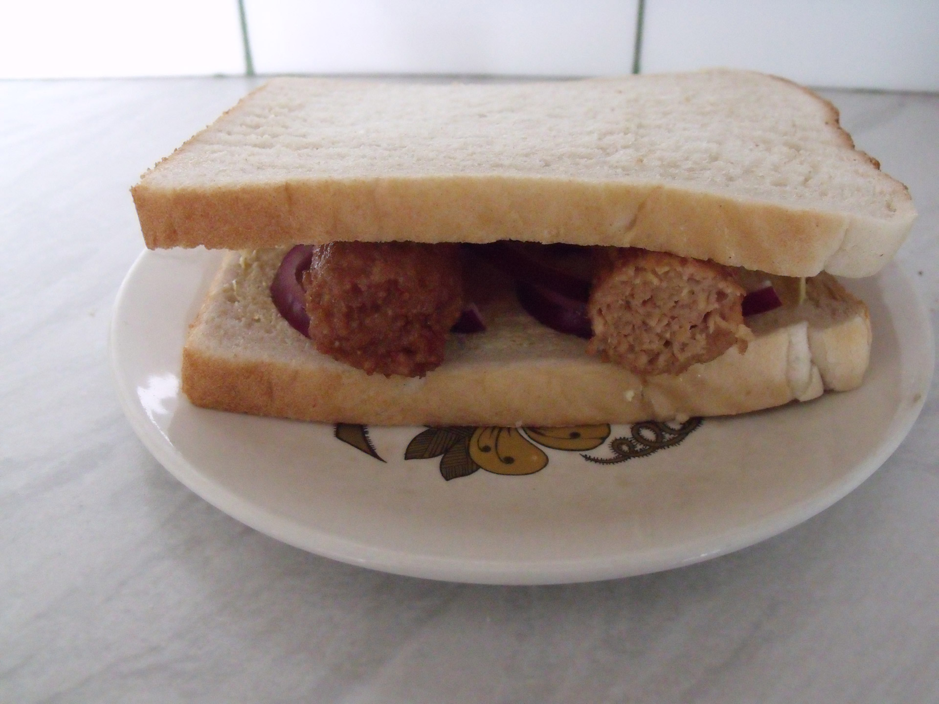 sausage sandwich brown sauce sandwich free photo