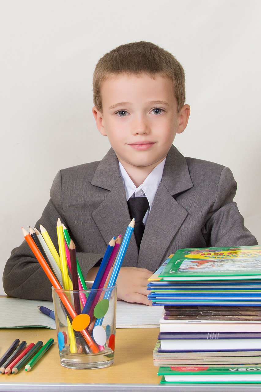 schoolboy at the desk sitting free photo