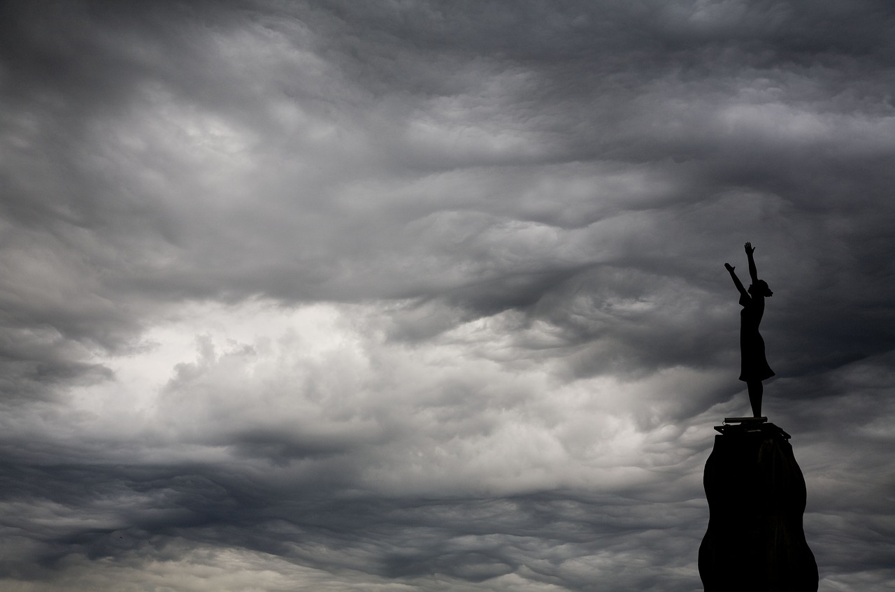 sculpture women who are looking cloud free photo