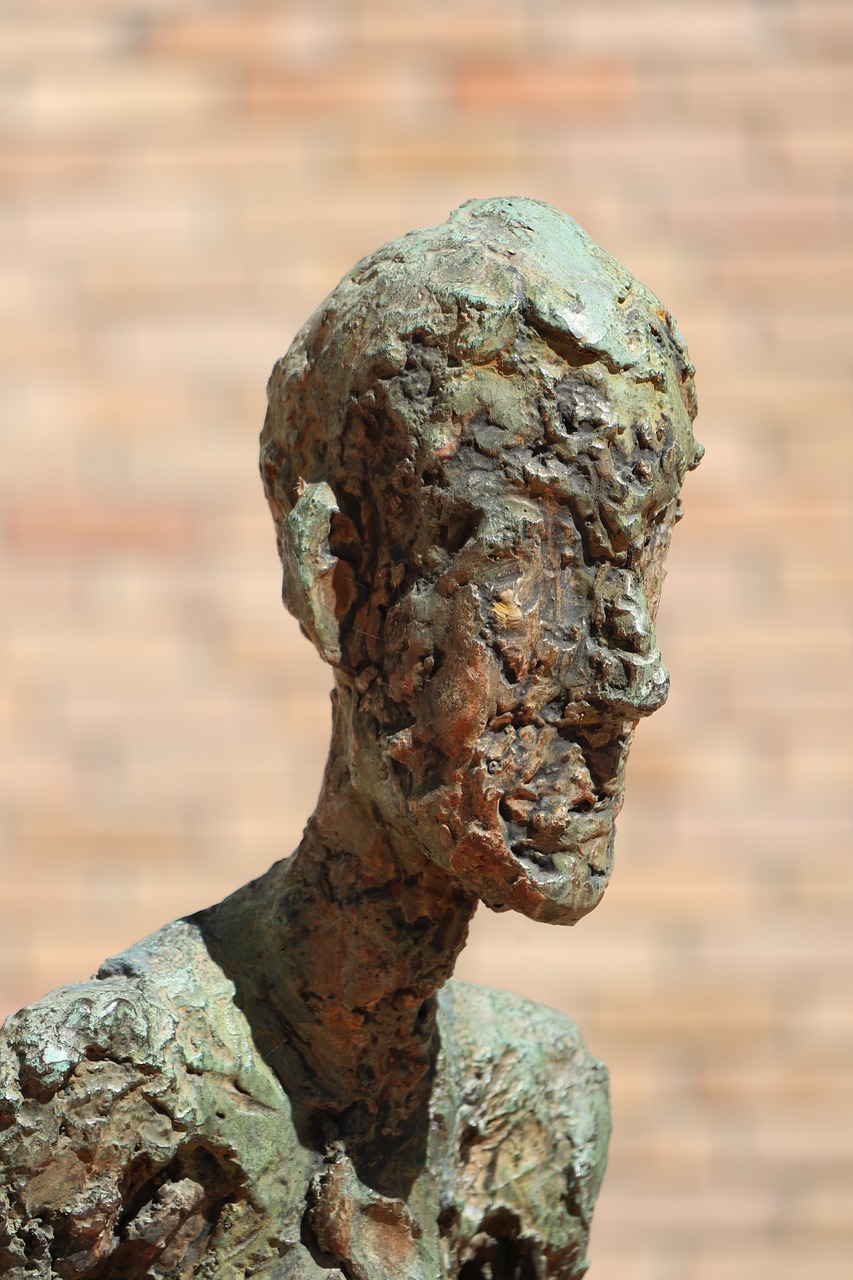 sculpture  bronze  bending its free photo