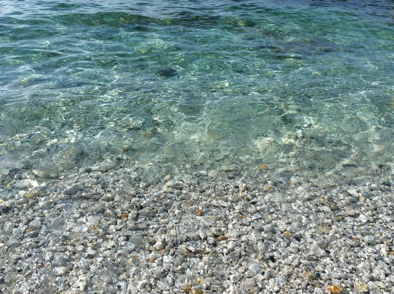 sea transparent pebbles free photo